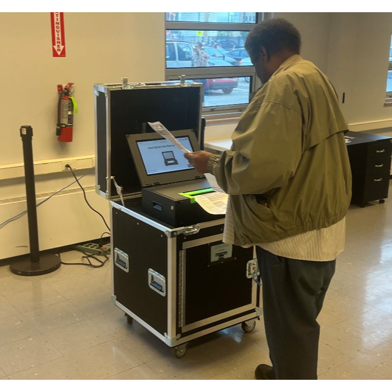 Voter using a ClearCast voting machine
